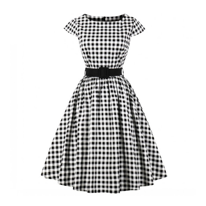 Georgina was wearing this Black and White Gingham Dress today! At lunch, we had been hotly discussing the fashion of the 50's. There were so many things to admire about the era but most important to us? The perfect red lip and timeless femininity!