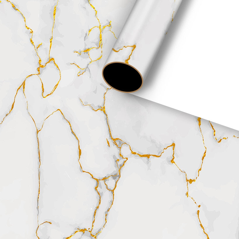 Is it marble? No. It just looks really cool-sort of like a marble statue, except it's a present wrapped in Gold Foil Granite and Marble Look Gift Wrap.